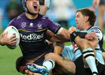 Hughes’ enormous effort with damaged arm propels Storm into grand ultimate as Sharks fall quick but once more