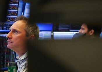 Shares acquire, gold sags on commerce deal optimism
