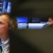 Shares acquire, gold sags on commerce deal optimism